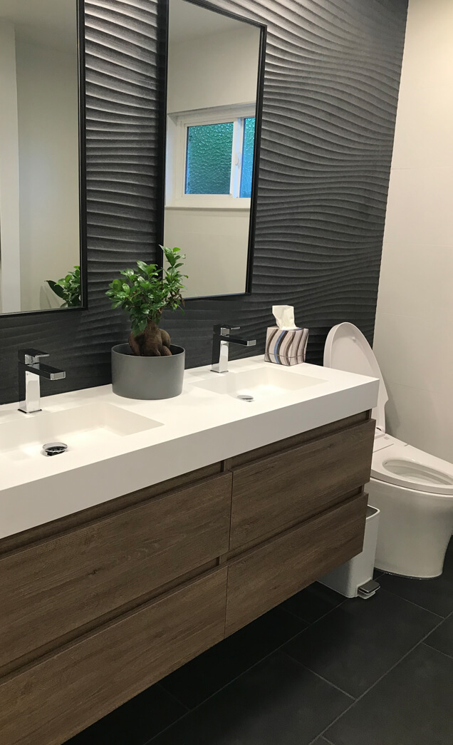 Image of a bathroom with countertop and bath area